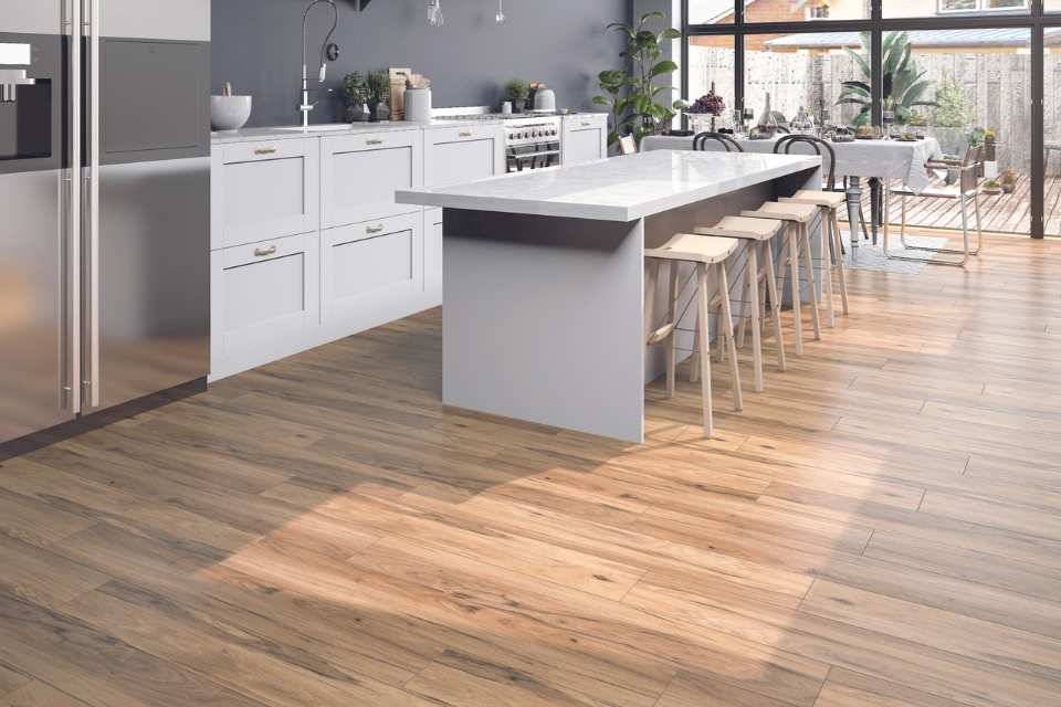 wood look luxury vinyl plank in modern kitchen with white island